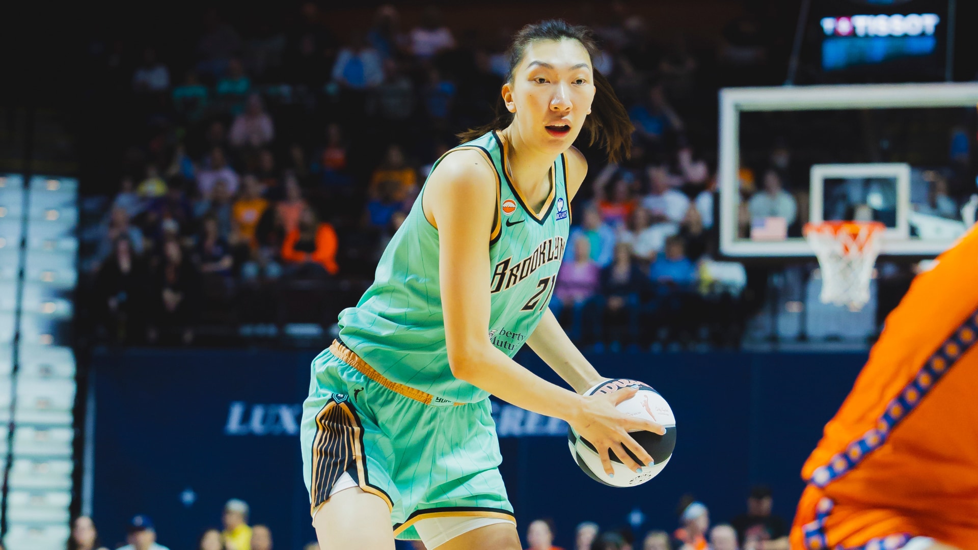 Han Xu of the New York Liberty with the ball in WNBA action
