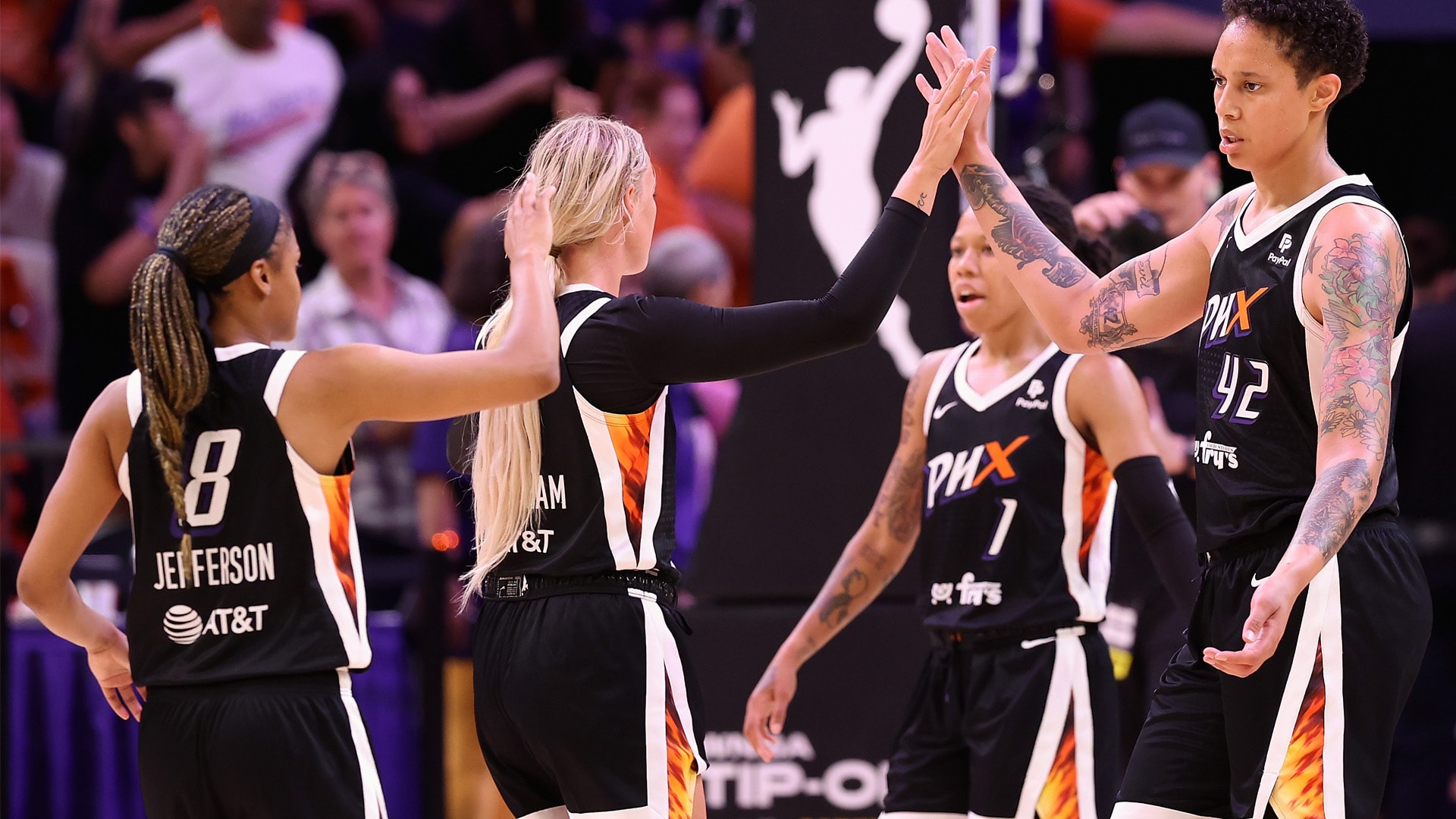 Brittney Griner #42 of the Phoenix Mercury high fives Sophie Cunningham #9 and Moriah Jefferson #8 during the first half of the WNBA game at Footprint Center on May 21, 2023