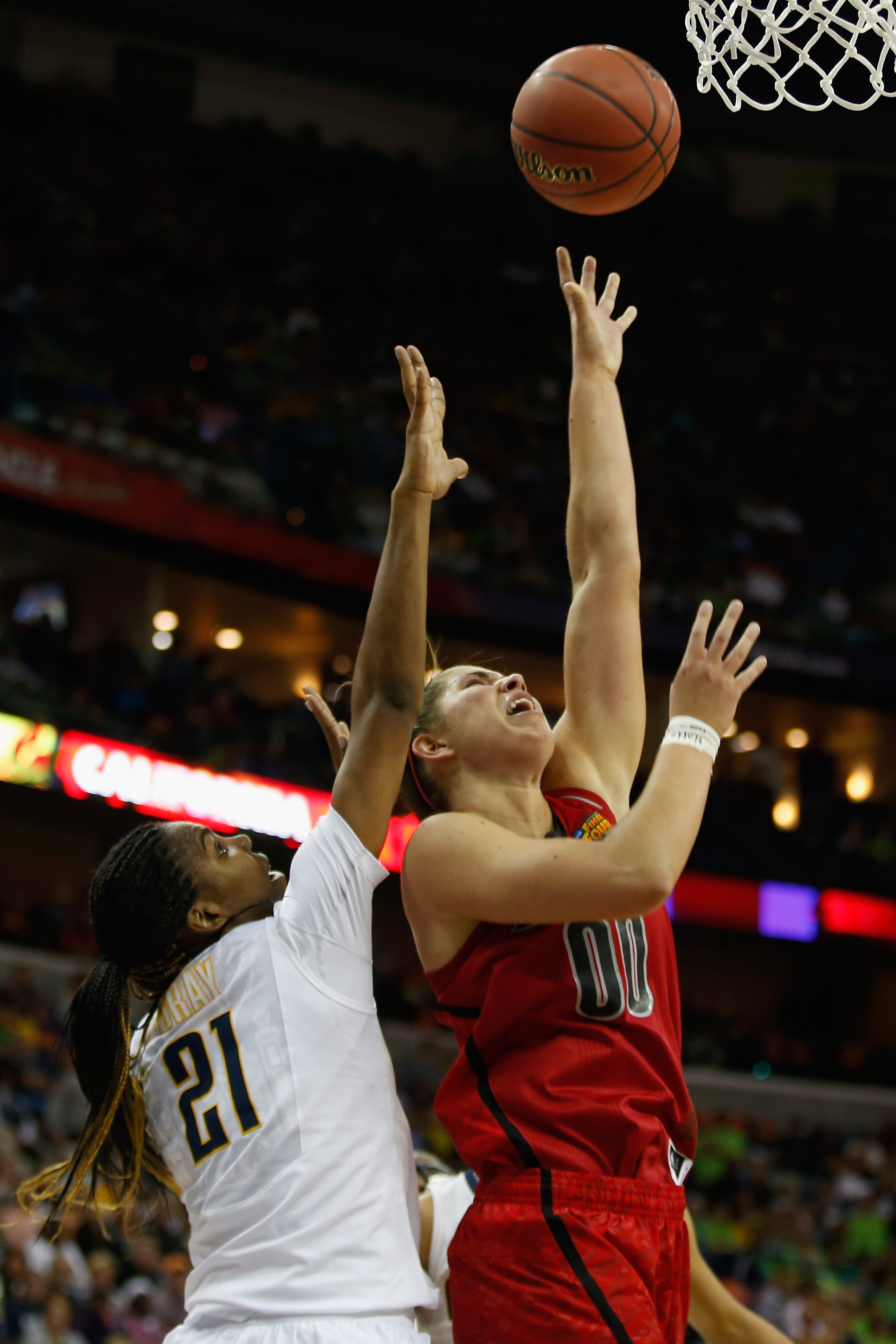 NEW ORLEANS, LA - APRIL 07: Sara Hammond #00 of the Louisville Cardinals shoots the ball over Reshanda Gray #21 of the California Golden Bears during the National Semifinal game of the 2013 NCAA Division I Women's Basketball Championship at the New Orleans Arena on April 7, 2013 in New Orleans, Louisiana. (Photo by Chris Graythen/Getty Images)