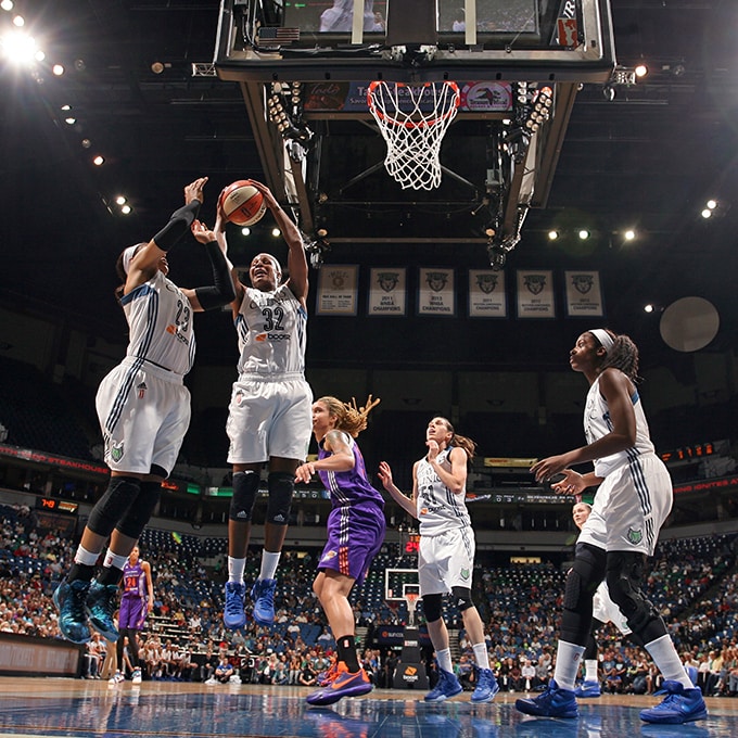 MINNEAPOLIS, MN - SEPTEMBER 24: Rebekkah Brunson #32 of the Minnesota Lynx grabs a rebound against the Phoenix Mercury during Game One of the WNBA Western Conference Finals on September 24, 2015 at Target Center in Minneapolis, Minnesota. NOTE TO USER: User expressly acknowledges and agrees that, by downloading and or using this Photograph, user is consenting to the terms and conditions of the Getty Images License Agreement. Mandatory Copyright Notice: Copyright 2015 NBAE (Photo by David Sherman/NBAE via Getty Images)