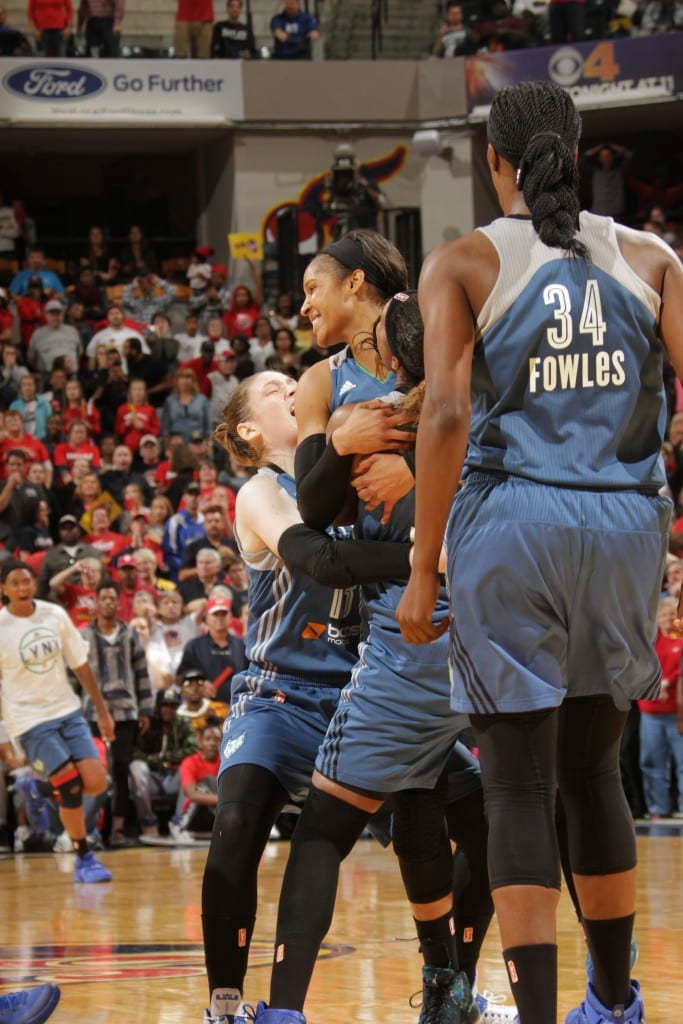 Maya Moore #23 of the Minnesota Lynx celebrates with her teammates after hitting the game winning shot during Game Three