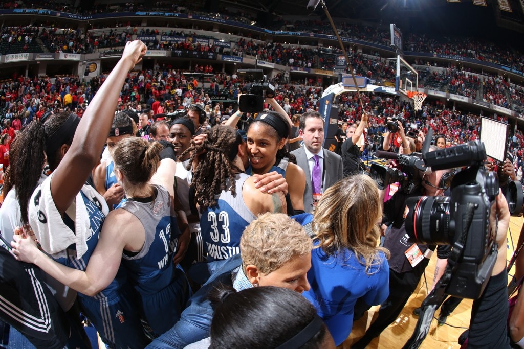 Maya Moore #23 of the Minnesota Lynx celebrates with her teammates after hitting the game winning shot during Game Three