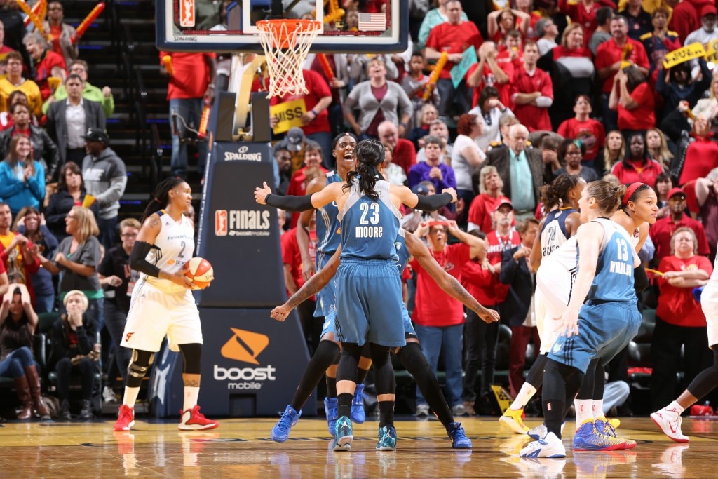 Maya Moore #23 of the Minnesota Lynx celebrates with her teammates after hitting the game winning shot during Game Three