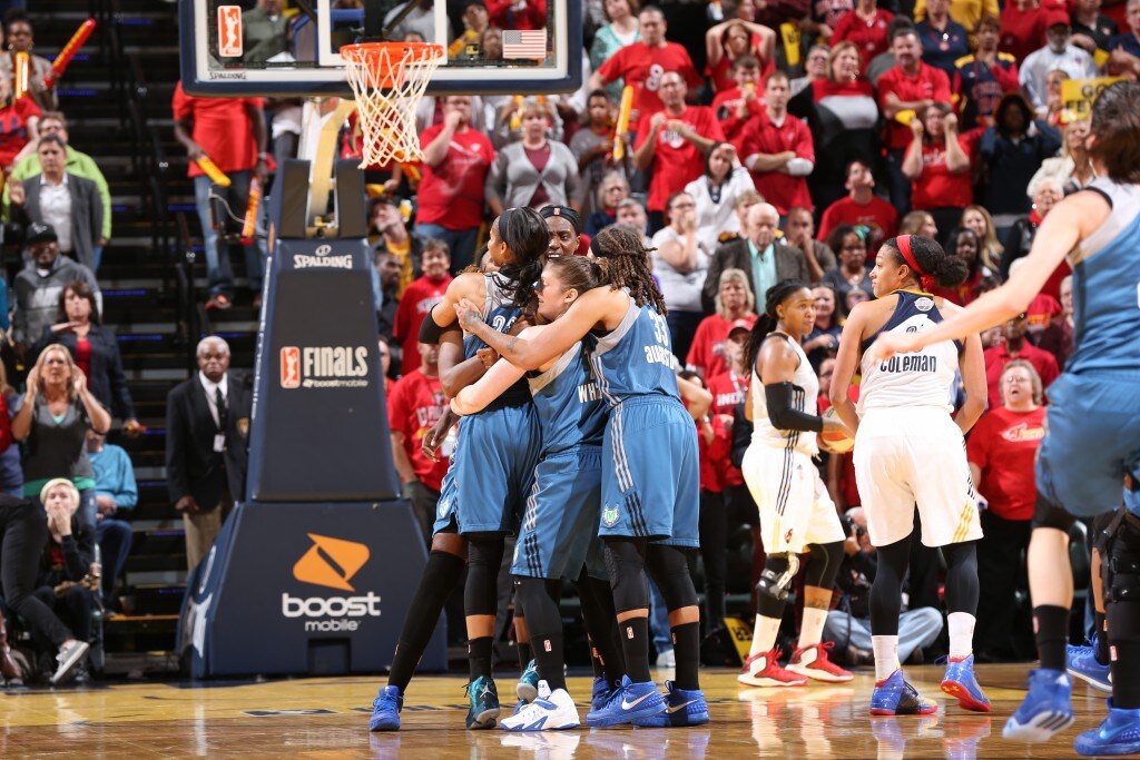 Maya Moore #23 of the Minnesota Lynx celebrates with her teammates after hitting the game winning shot during Game Three