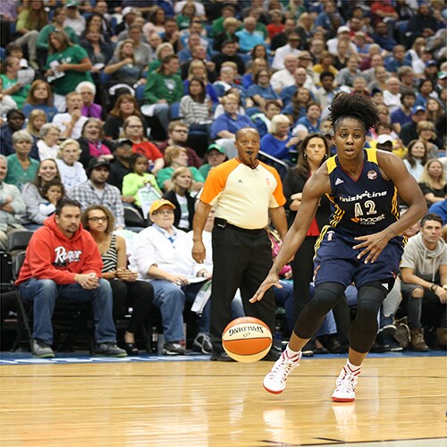 MINNEAPOLIS, MN - OCTOBER 6: Shenise Johnson #42 of the Indiana Fever handles the ball against the Minnesota Lynx during Game Two of the 2015 WNBA Finals on October 6, 2015 at Target Center in Minneapolis, Minnesota. NOTE TO USER: User expressly acknowledges and agrees that, by downloading and or using this Photograph, user is consenting to the terms and conditions of the Getty Images License Agreement. Mandatory Copyright Notice: Copyright 2015 NBAE (Photo by Jordan Johnson/NBAE via Getty Images)