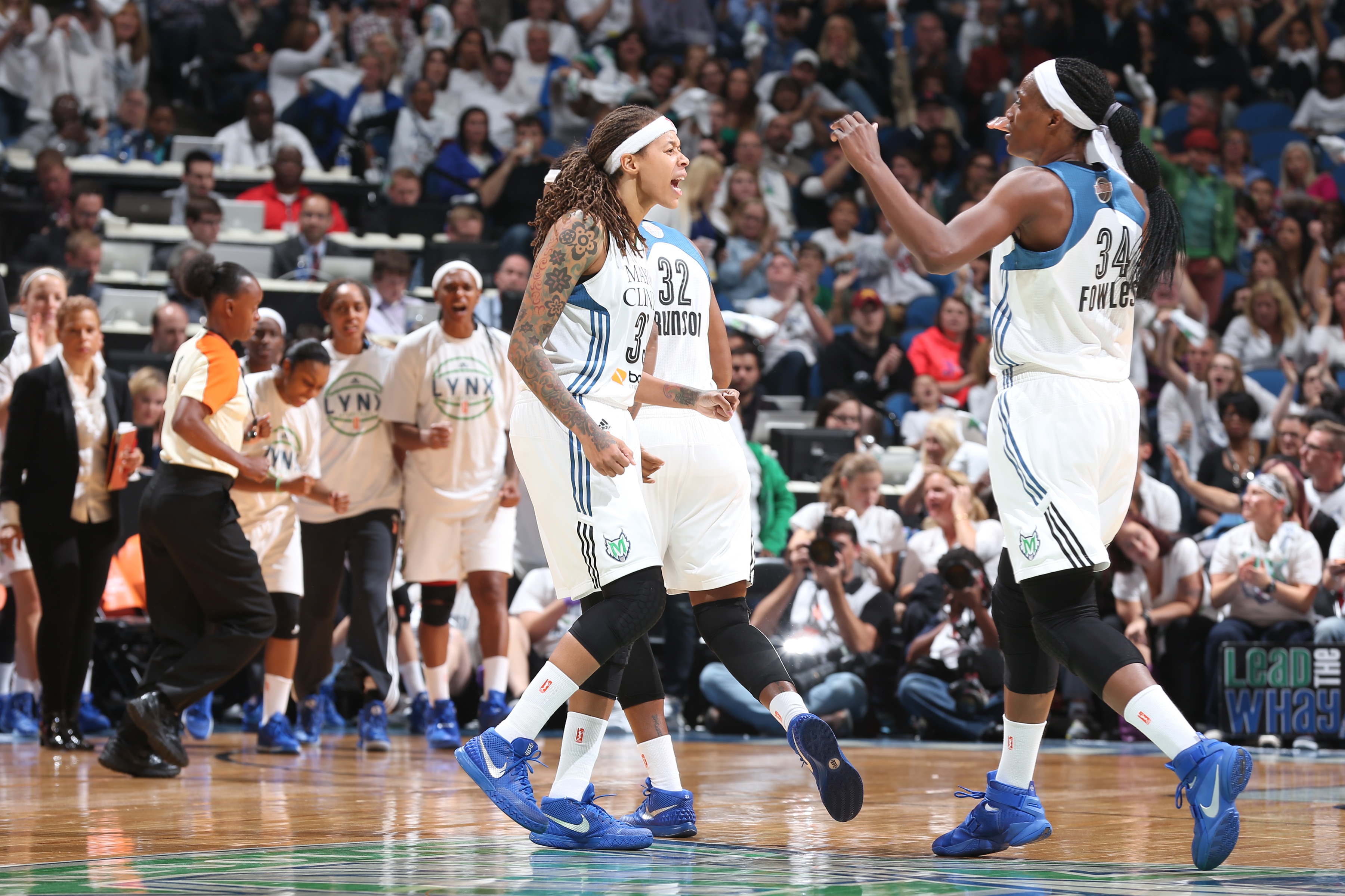 MINNEAPOLIS, MN - OCTOBER 14:  Seimone Augustus #33 of the Minnesota Lynx and Sylvia Fowles #34 of the Minnesota Lynx celebrate during Game Five of the 2015 WNBA Finals against the Indiana Fever on October 14, 2015 at Target Center in Minneapolis, Minnesota.  NOTE TO USER: User expressly acknowledges and agrees that, by downloading and or using this Photograph, user is consenting to the terms and conditions of the Getty Images License Agreement. Mandatory Copyright Notice: Copyright 2015 NBAE (Photo by Jordan Johnson/NBAE via Getty Images)