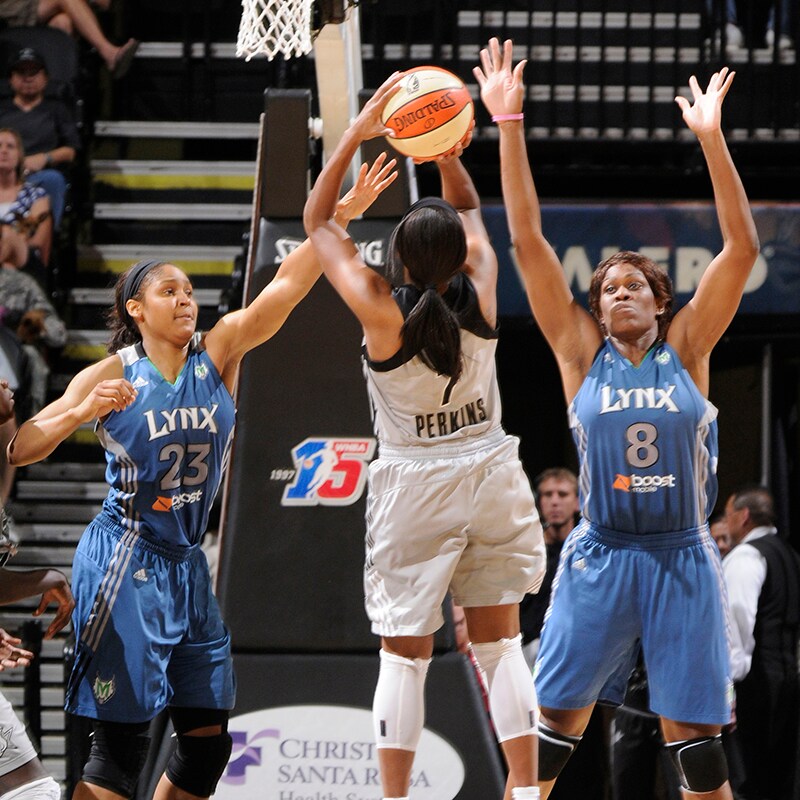 SAN ANTONIO, TX - AUGUST 28: Jia Perkins #7 of the San Antonio Silver Stars shoots against Maya Moore #23 and Taj McWilliams-Franklin #8 of the Minnesota Lynx at the AT&T Center on August 28, 2011 in San Antonio, Texas. NOTE TO USER: User expressly acknowledges and agrees that, by downloading and or using this photograph, user is consenting to the terms and conditions of the Getty Images License Agreement. Mandatory Copyright Notice: Copyright 2011 NBAE (Photos by D. Clarke Evans/NBAE via Getty Images)