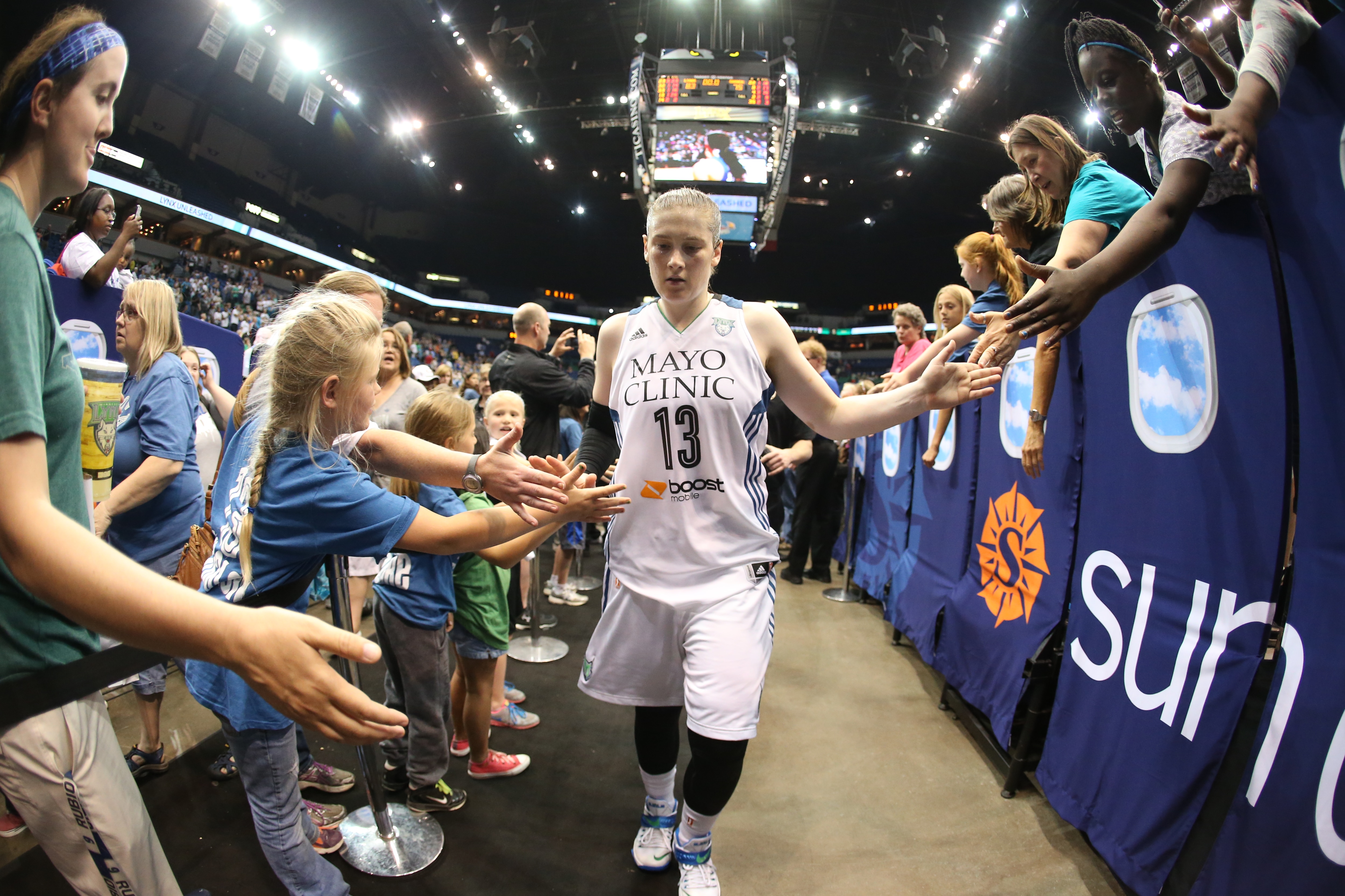 MINNEAPOLIS, MN - JUNE 5: Lindsay Whalen #13 of the Minnesota Lynx celebrates with fans after the game against the Tulsa Shock during the season opener of their WNBA game on June 5, 2015 at Target Center in Minneapolis, Minnesota. NOTE TO USER: User expressly acknowledges and agrees that, by downloading and or using this Photograph, user is consenting to the terms and conditions of the Getty Images License Agreement. Mandatory Copyright Notice: Copyright 2015 NBAE (Photo by David Sherman/NBAE via Getty Images)