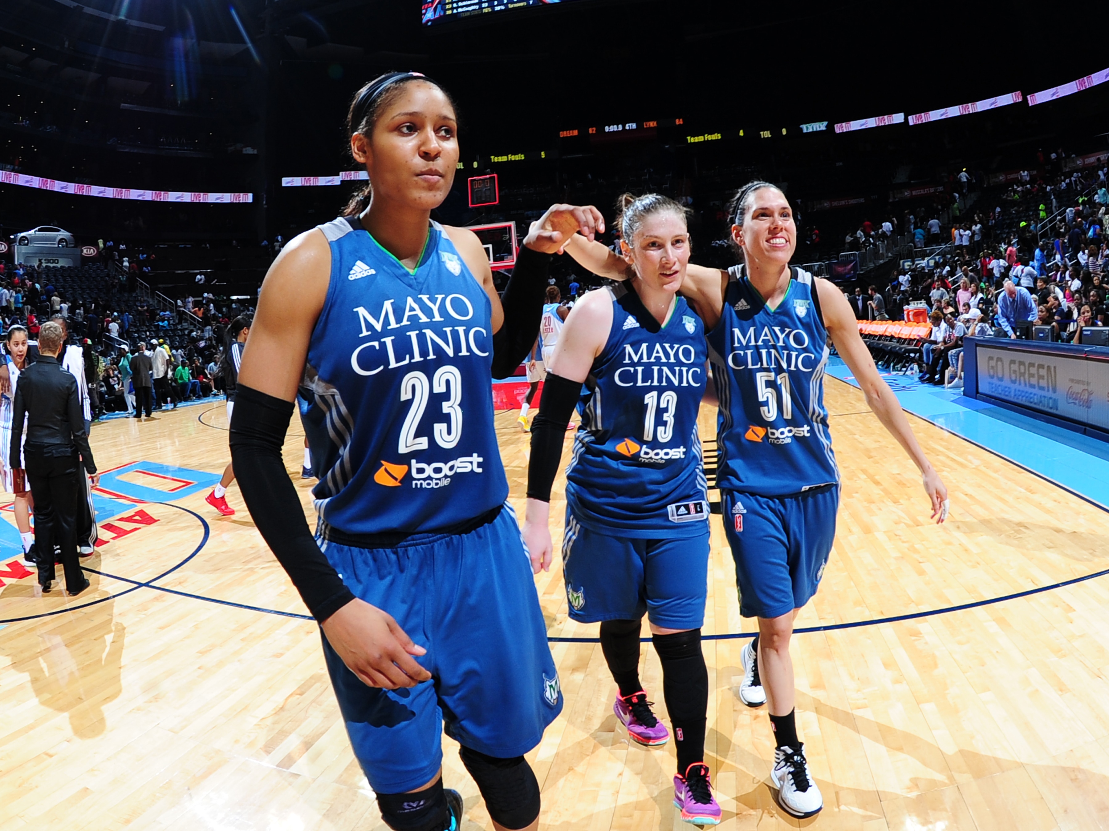 ATLANTA, GA - AUGUST 14: Maya Moore #23, Lindsay Whalen #13, and Anna Cruz #51 of the Minnesota Lynx walk off the court after a game against the Atlanta Dream on August 14, 2015 at Philips Arena in Atlanta, Georgia. NOTE TO USER: User expressly acknowledges and agrees that, by downloading and/or using this Photograph, user is consenting to the terms and conditions of the Getty Images License Agreement. Mandatory Copyright Notice: Copyright 2015 NBAE (Photo by Scott Cunningham/NBAE via Getty Images)