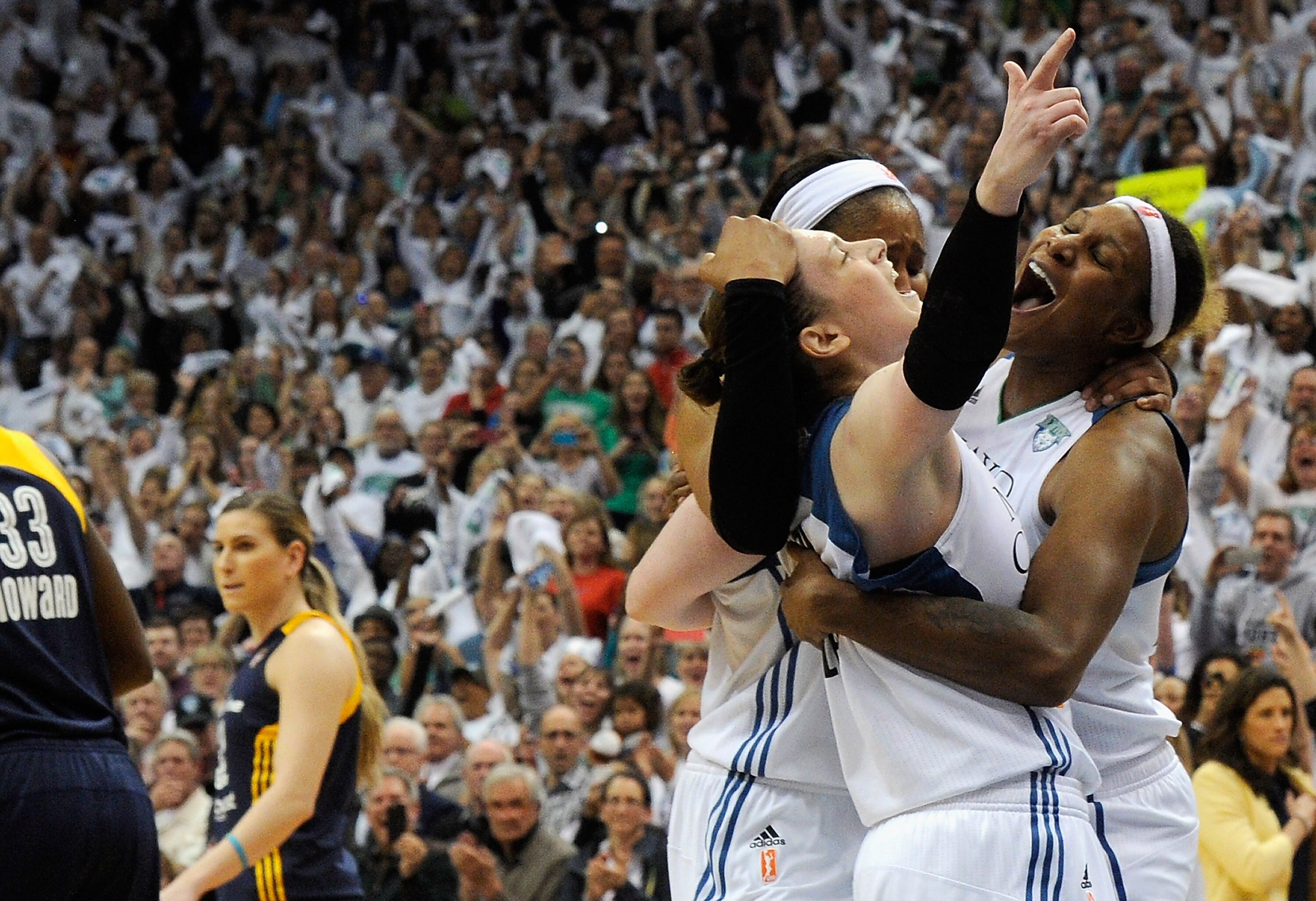 MINNEAPOLIS, MN - OCTOBER 14: (L-R) Lindsay Whalen #13, Maya Moore #23 and Sylvia Fowles #34 of the Minnesota Lynx celebrate a win in Game Five of the 2015 WNBA Finals against the Indiana Fever on October 14, 2015 at Target Center in Minneapolis, Minnesota. The Lynx defeated the Fever 69-52 to win the WNBA Championship. NOTE TO USER: User expressly acknowledges and agrees that, by downloading and or using this Photograph, user is consenting to the terms and conditions of the Getty Images License Agreement. (Photo by Hannah Foslien/Getty Images)