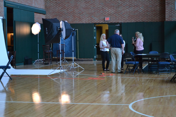 A group of Fever staff members awaits the team photos.