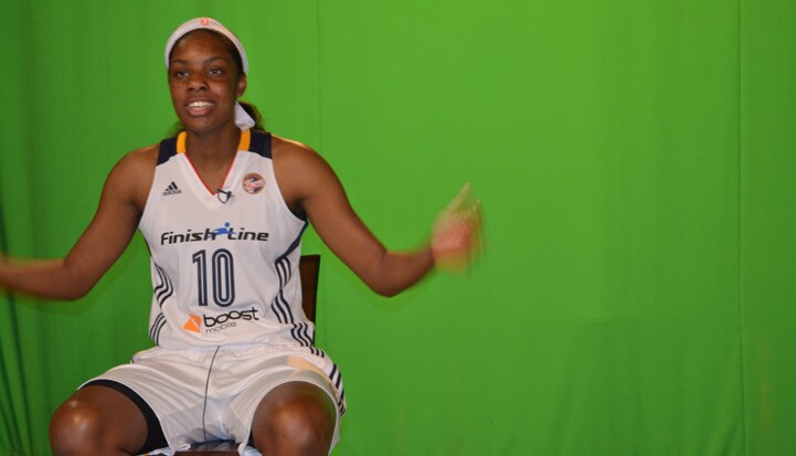 Chelsea Gardner (#10) during a photoshoot in front of a green screen.