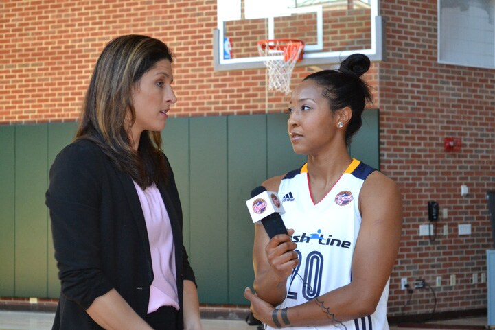 Briann January interviews her head coach Stephanie White during Indiana Fever Media Day.