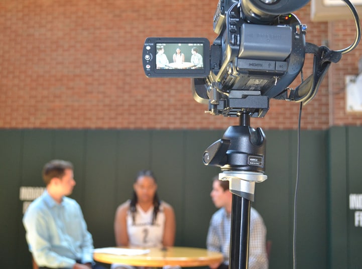 A video camera records Erlana Larkins talking to feverbasketball.com during Indiana Fever Media Day.