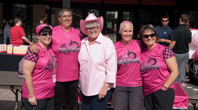 Coach Dunn with fans at the Bright Pink Party