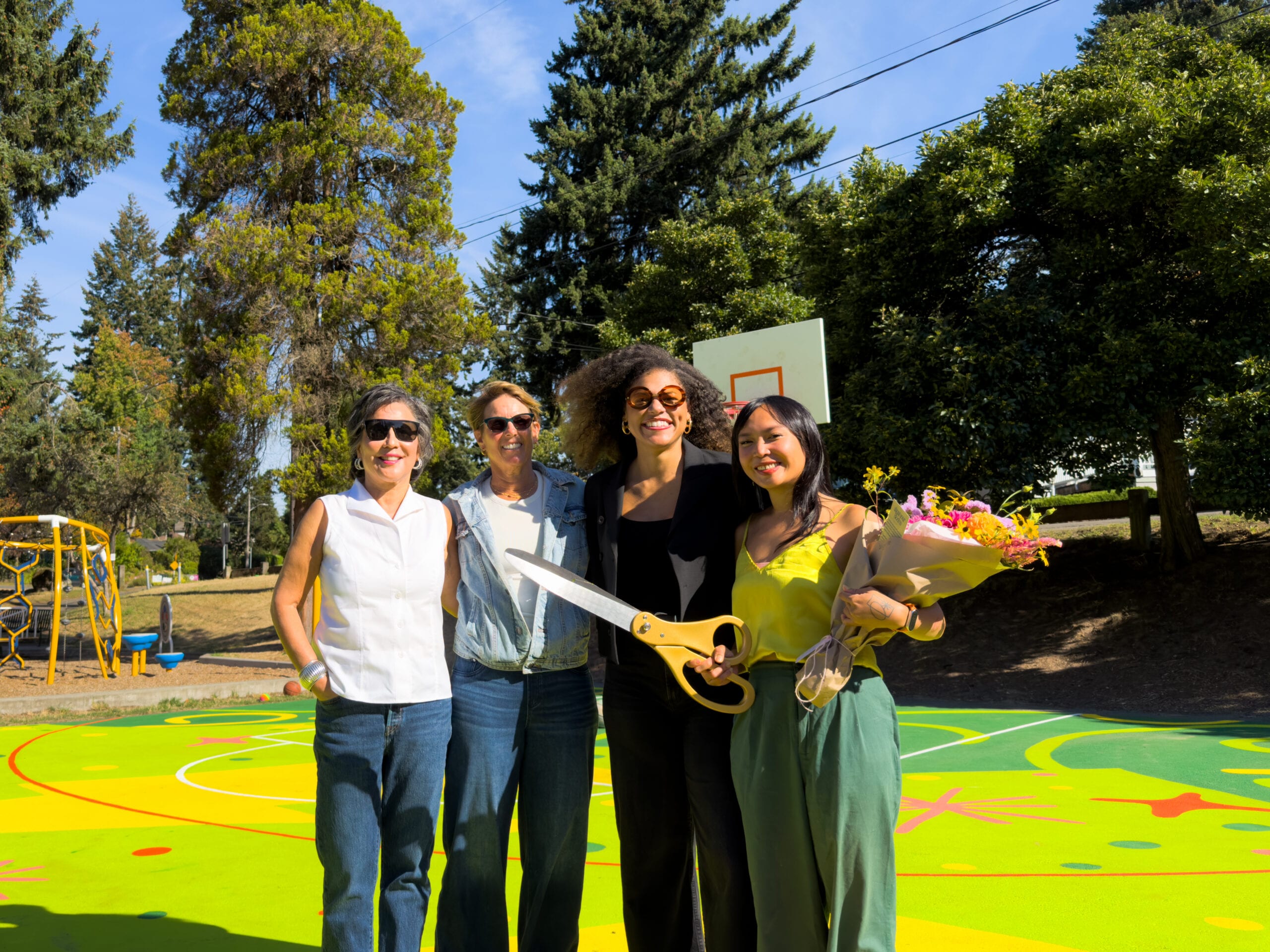 Representatives from the Storm and artist Nikita Ares at Victory Heights