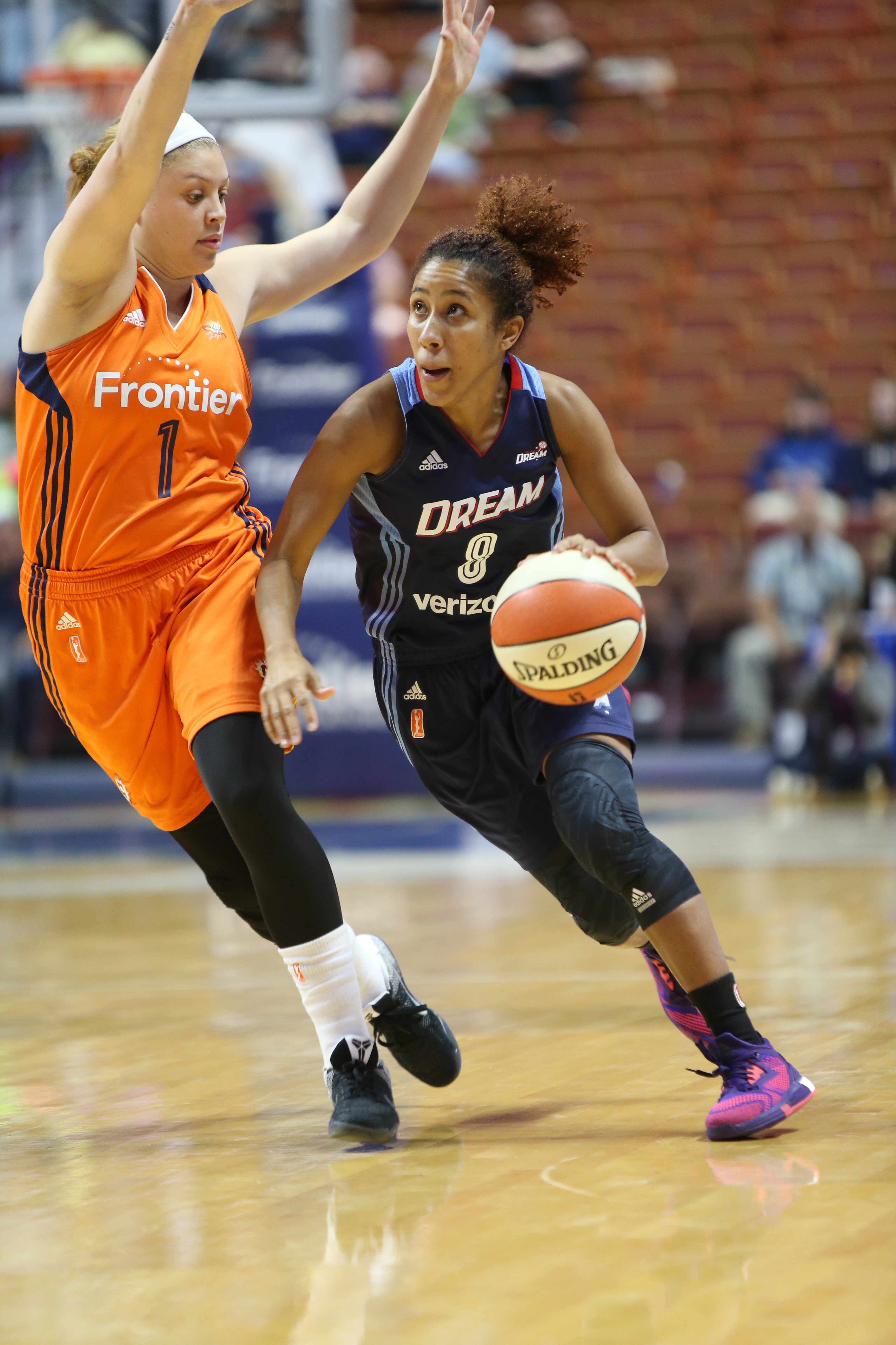 UNCASVILLE, CT - JUNE 3: Carla Cortijo #8 of the Atlanta Dream dribbles the ball against Rachel Banham #1 of the Connecticut Sun on June 3, 2016 at Mohegan Sun Arena in Uncasville, CT. NOTE TO USER: User expressly acknowledges and agrees that, by downloading and or using this Photograph, user is consenting to the terms and conditions of the Getty Images License Agreement. Mandatory Copyright Notice: Copyright 2016 NBAE (Photo by Chris Marion/NBAE via Getty Images)