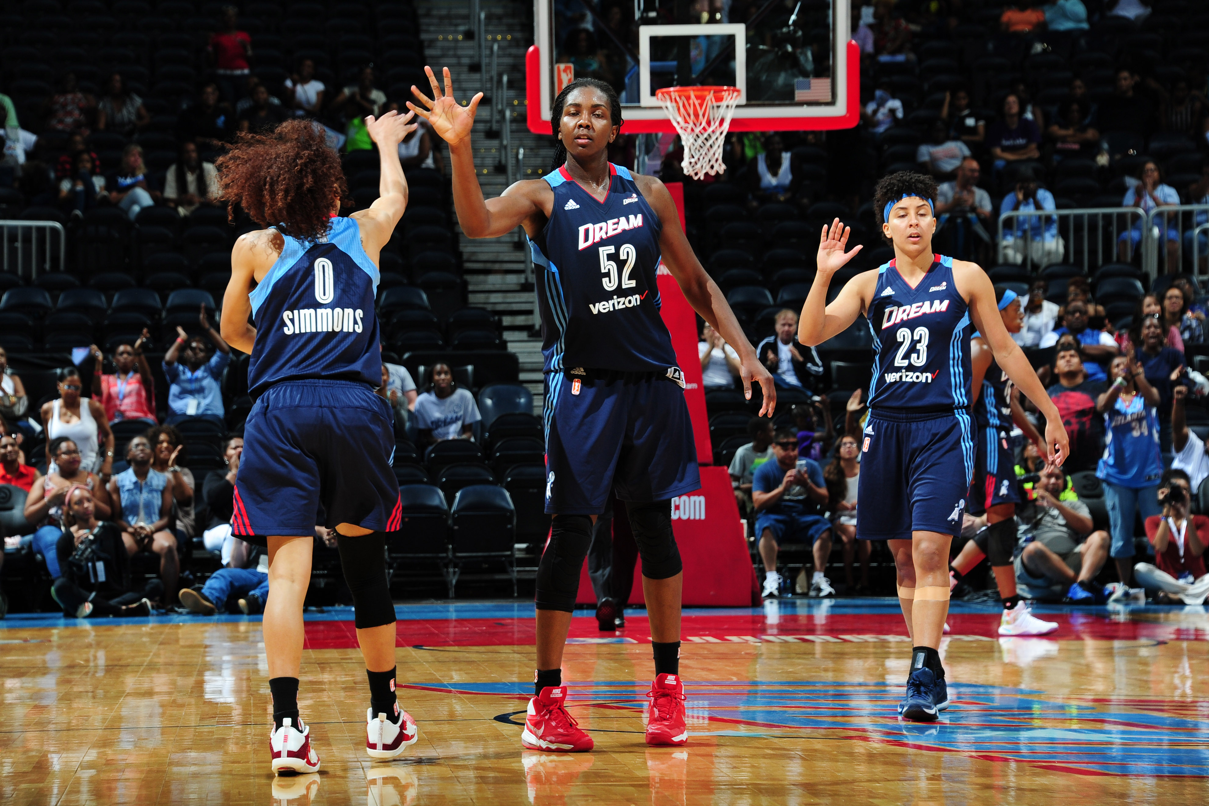 ATLANTA, GA - JUNE 12: Meighan Simmons #0 high fives teammate Elizabeth Williams #52 of the Atlanta Dream after a play against the Connecticut Sun during the game on June 12, 2016 at Philips Arena in Atlanta, Georgia. NOTE TO USER: User expressly acknowledges and agrees that, by downloading and or using this Photograph, user is consenting to the terms and conditions of the Getty Images License Agreement. Mandatory Copyright Notice: Copyright 2016 NBAE (Photo by Scott Cunningham/NBAE via Getty Images)