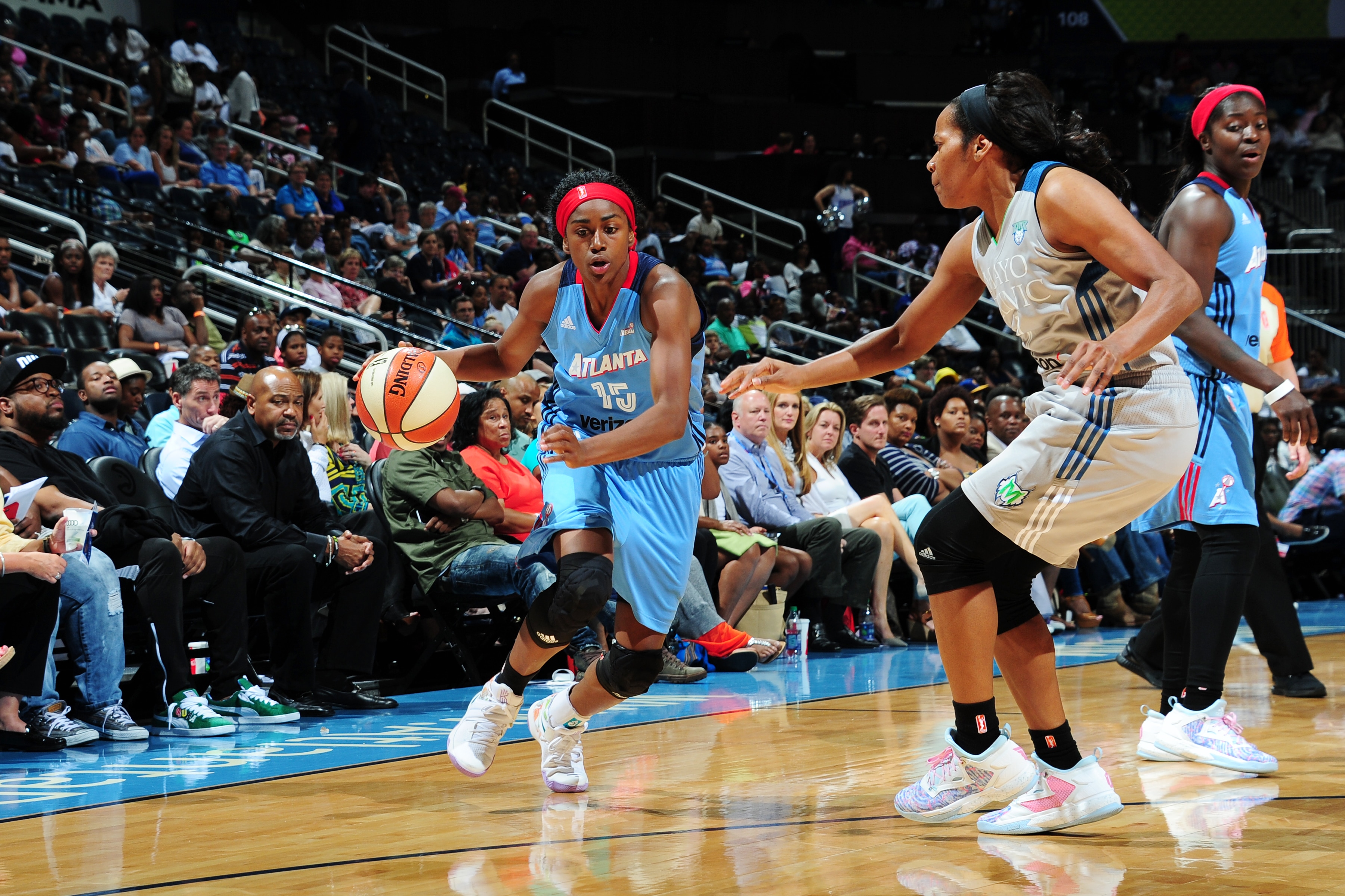 ATLANTA, GA - JUNE 10: Tiffany Hayes #15 of the Atlanta Dream drives to the basket against Jia Perkins #7 of the Minnesota Lynx on June 10, 2016 at Philips Arena in Atlanta, Georgia. NOTE TO USER: User expressly acknowledges and agrees that, by downloading and/or using this Photograph, user is consenting to the terms and conditions of the Getty Images License Agreement. Mandatory Copyright Notice: Copyright 2016 NBAE (Photo by Scott Cunningham/NBAE via Getty Images)