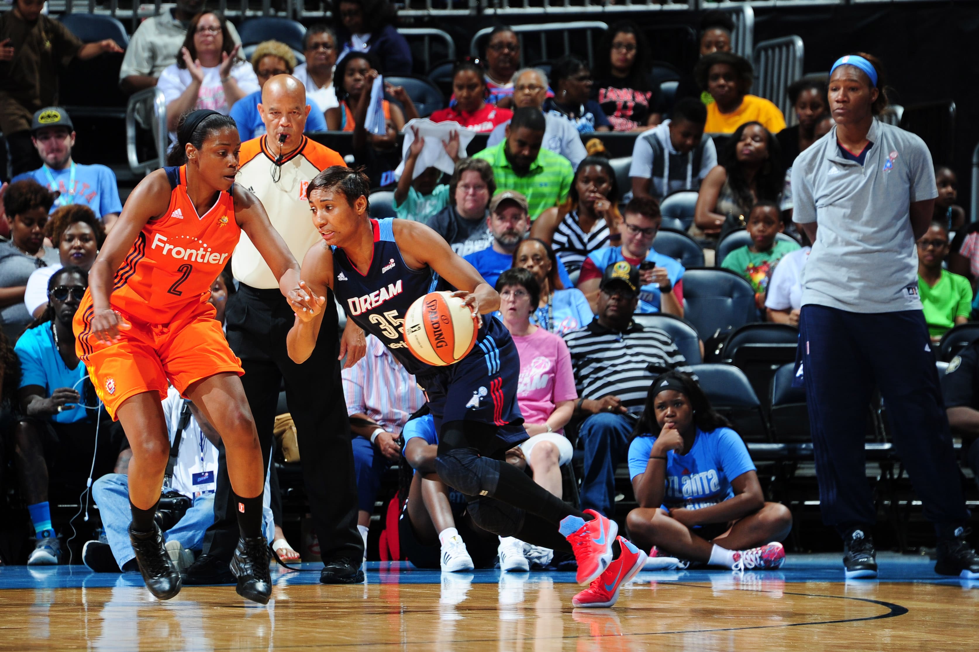 ATLANTA, GA - JUNE 12: Angel McCoughtry #35 of the Atlanta Dream drives to the basket against Camille Little #2 of the Connecticut Sun during the game on June 12, 2016 at Philips Arena in Atlanta, Georgia. NOTE TO USER: User expressly acknowledges and agrees that, by downloading and or using this Photograph, user is consenting to the terms and conditions of the Getty Images License Agreement. Mandatory Copyright Notice: Copyright 2016 NBAE (Photo by Scott Cunningham/NBAE via Getty Images)