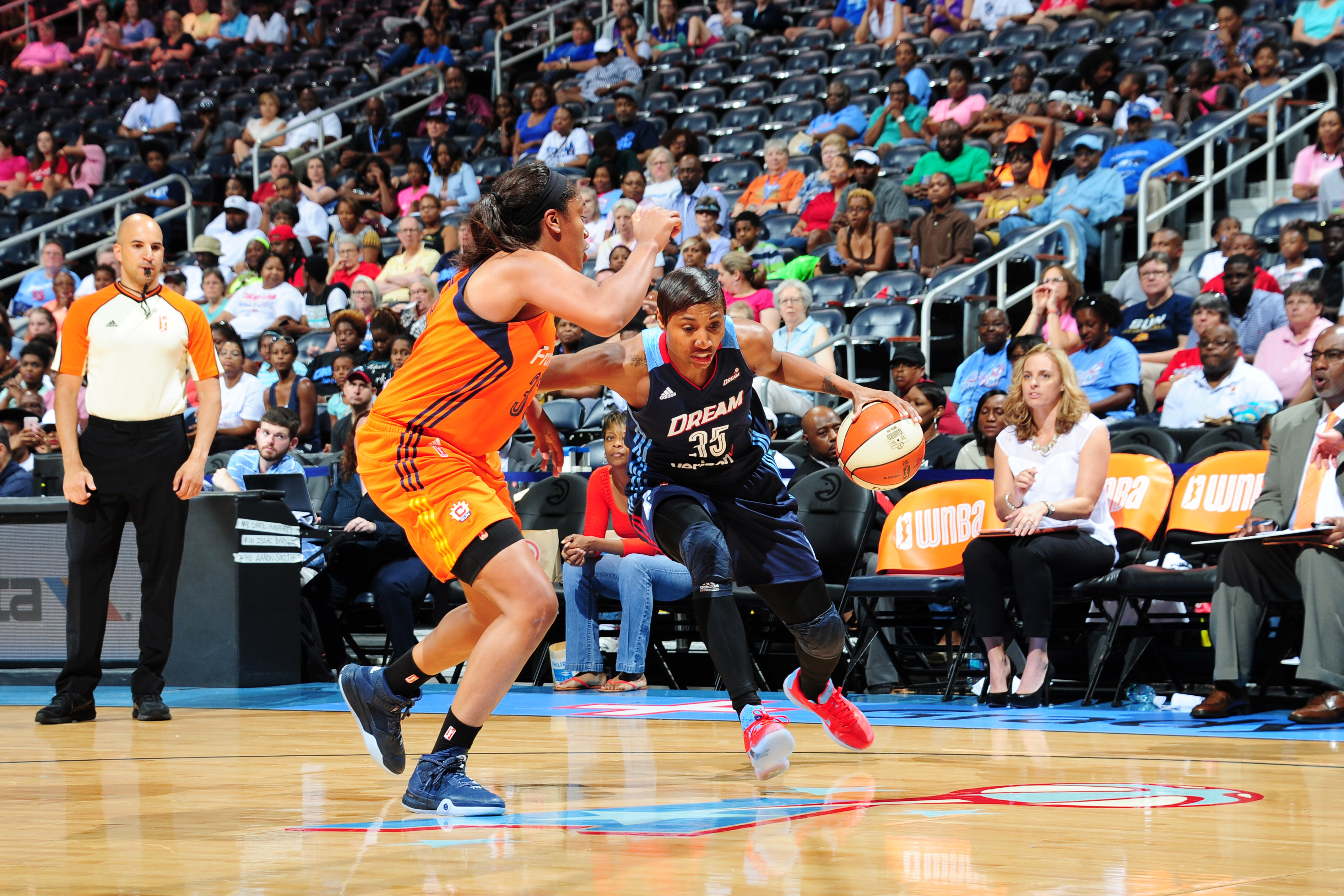 ATLANTA, GA - JUNE 12: Angel McCoughtry #35 of the Atlanta Dream moves the ball against the Connecticut Sun during the game on June 12, 2016 at Philips Arena in Atlanta, Georgia. NOTE TO USER: User expressly acknowledges and agrees that, by downloading and or using this Photograph, user is consenting to the terms and conditions of the Getty Images License Agreement. Mandatory Copyright Notice: Copyright 2016 NBAE (Photo by Scott Cunningham/NBAE via Getty Images)