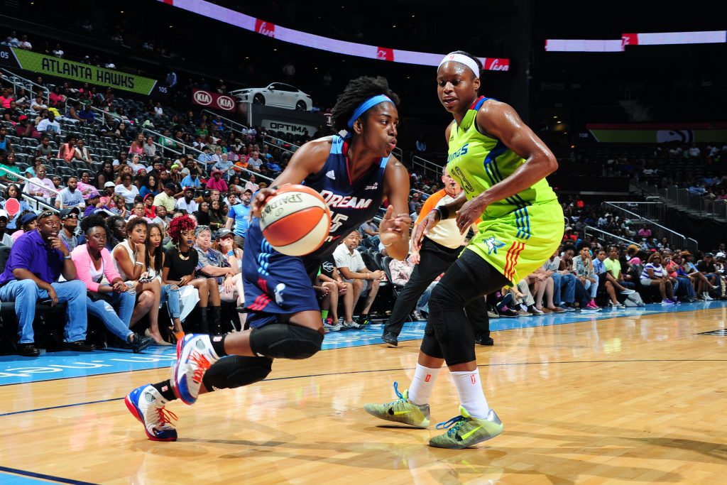 ATLANTA, GA - JULY 8: Tiffany Hayes #15 of the Atlanta Dream drives to the basket during the game against Karima Christmas #13 of the Dallas Wings on July 8, 2016 at Philips Arena in Atlanta, Georgia. NOTE TO USER: User expressly acknowledges and agrees that, by downloading and/or using this Photograph, user is consenting to the terms and conditions of the Getty Images License Agreement. Mandatory Copyright Notice: Copyright 2016 NBAE (Photo by Scott Cunningham/NBAE via Getty Images)