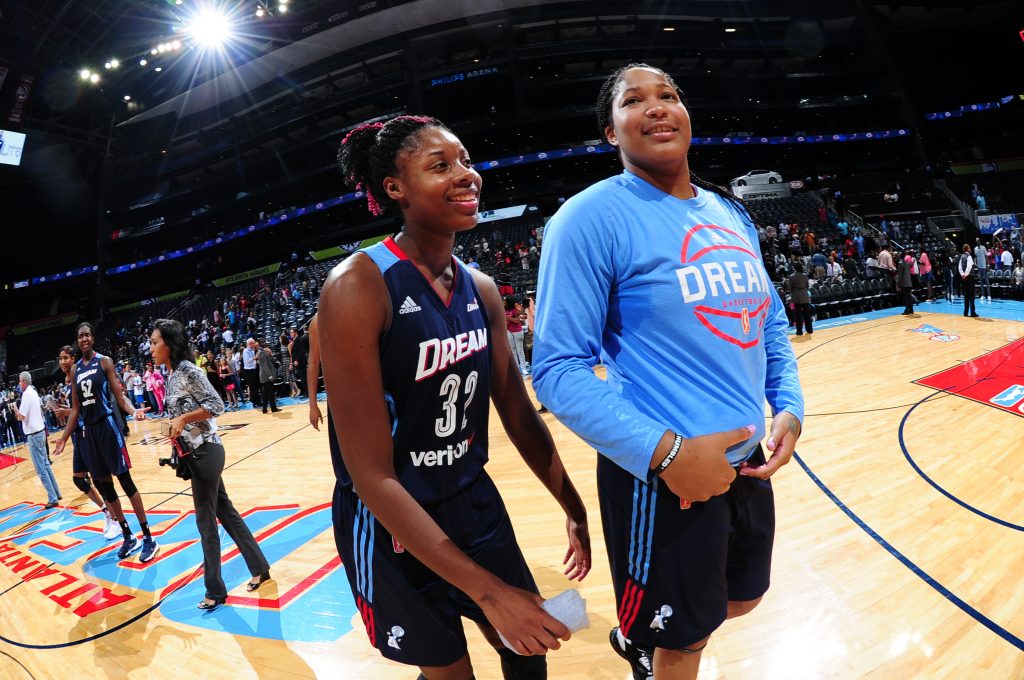 ATLANTA, GA - SEPTEMBER 15: Bria Holmes #32 of the Atlanta Dream and Markeisha Gatling #34 of the Atlanta Dream celebrate a win against the Washington Mystics on September 15, 2016 at Philips Arena in Atlanta, Georgia. NOTE TO USER: User expressly acknowledges and agrees that, by downloading and/or using this Photograph, user is consenting to the terms and conditions of the Getty Images License Agreement. Mandatory Copyright Notice: Copyright 2016 NBAE (Photo by Scott Cunningham/NBAE via Getty Images)