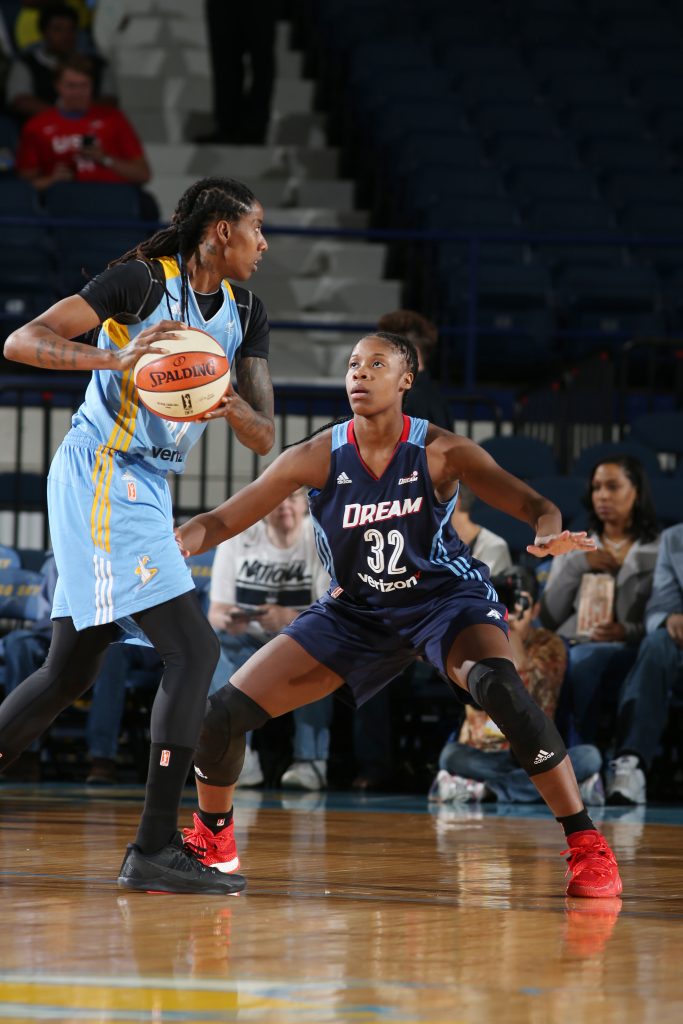 ROSEMONT, IL - SEPTEMBER 25: Jessica Breland #51 of the Chicago Sky handles the ball against Bria Holmes #32 of the Atlanta Dream during Round Two of the 2016 WNBA Playoffs on September 25, 2016 at Allstate Arena in Rosemont, IL. NOTE TO USER: User expressly acknowledges and agrees that, by downloading and or using this photograph, User is consenting to the terms and conditions of the Getty Images License Agreement. Mandatory Copyright Notice: Copyright 2016 NBAE (Photo by Gary Dineen/NBAE via Getty Images)