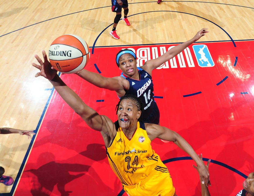 ATLANTA, GA - MAY 29: Tamika Catchings #24 of the Indiana Fever and Rachel Hollivay #14 of the Atlanta Dream go after a rebound on May 29, 2016 at Philips Arena in Atlanta, Georgia. NOTE TO USER: User expressly acknowledges and agrees that, by downloading and/or using this Photograph, user is consenting to the terms and conditions of the Getty Images License Agreement. Mandatory Copyright Notice: Copyright 2016 NBAE (Photo by Scott Cunningham/NBAE via Getty Images)