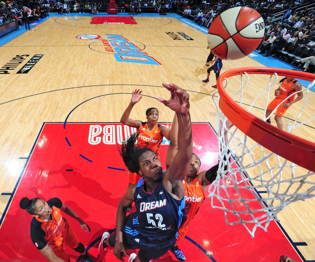 ATLANTA, GA - JUNE 12: Elizabeth Williams #52 of the Atlanta Dream shoots against the Connecticut Sun during the game on June 12, 2016 at Philips Arena in Atlanta, Georgia. NOTE TO USER: User expressly acknowledges and agrees that, by downloading and or using this Photograph, user is consenting to the terms and conditions of the Getty Images License Agreement. Mandatory Copyright Notice: Copyright 2016 NBAE (Photo by Scott Cunningham/NBAE via Getty Images)