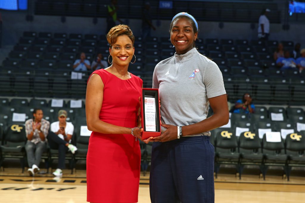 ATLANTA, GA - JULY 22: Elizabeth Williams #52 of the Atlanta Dream receives the June WNBA Cares Community Assist Award presented by State Farm for her efforts to encourage youth education and literacy through the Dreams recent community initiatives before the game against the Dallas Wings on July 22, 2016 at McCamish Pavilion in Atlanta, Georgia. NOTE TO USER: User expressly acknowledges and agrees that, by downloading and or using this Photograph, user is consenting to the terms and conditions of the Getty Images License Agreement. Mandatory Copyright Notice: Copyright 2016 NBAE (Photo by Kevin Liles/NBAE via Getty Images)