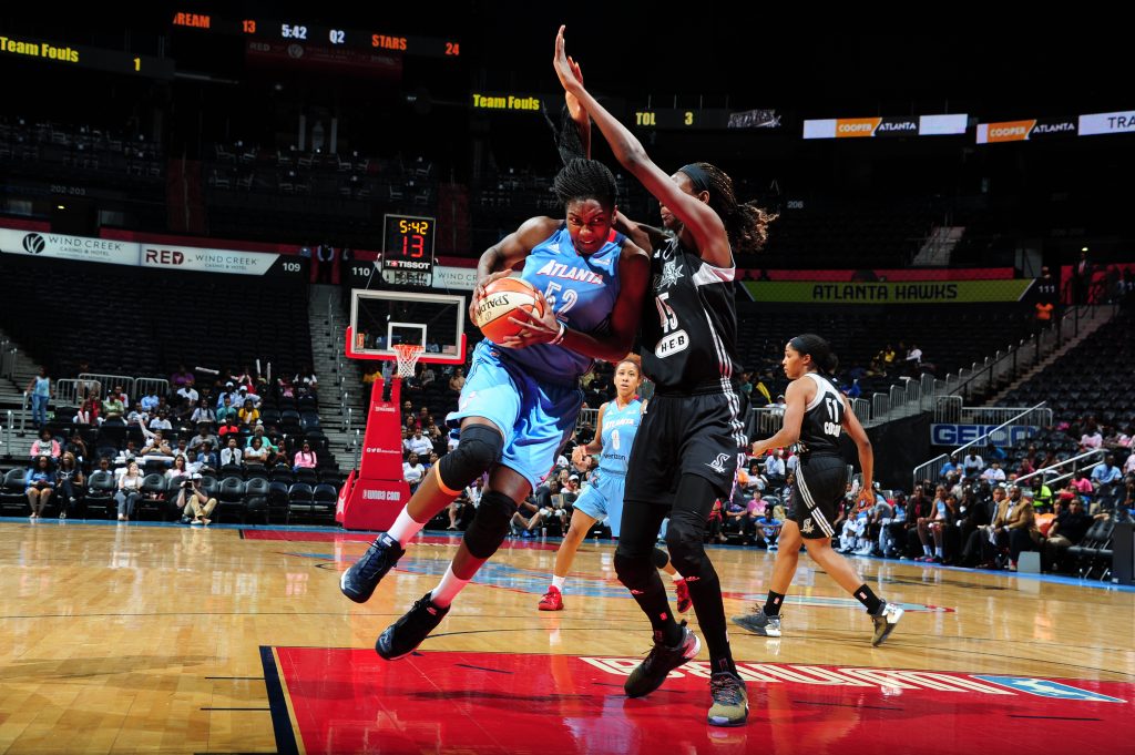 ATLANTA, GA - SEPTEMBER 13: Elizabeth Williams #52 of the Atlanta Dream handles the ball against the San Antonio Stars on September 13, 2016 at Philips Arena in Atlanta, Georgia. NOTE TO USER: User expressly acknowledges and agrees that, by downloading and/or using this Photograph, user is consenting to the terms and conditions of the Getty Images License Agreement. Mandatory Copyright Notice: Copyright 2016 NBAE (Photo by Scott Cunningham/NBAE via Getty Images)