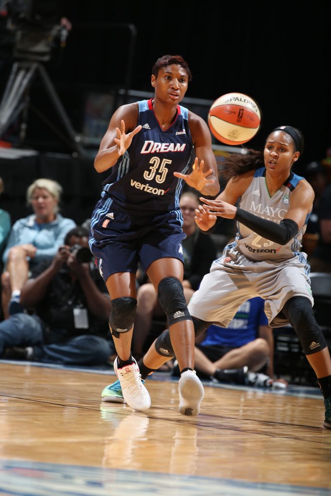 MINNEAPOLIS, MN - SEPTEMBER 17: Angel McCoughtry #35 of the Atlanta Dream passes the ball against Maya Moore #23 of the Minnesota Lynx on September 17, 2016 at Target Center in Minneapolis, Minnesota. NOTE TO USER: User expressly acknowledges and agrees that, by downloading and or using this Photograph, user is consenting to the terms and conditions of the Getty Images License Agreement. Mandatory Copyright Notice: Copyright 2016 NBAE (Photo by David Sherman/NBAE via Getty Images)