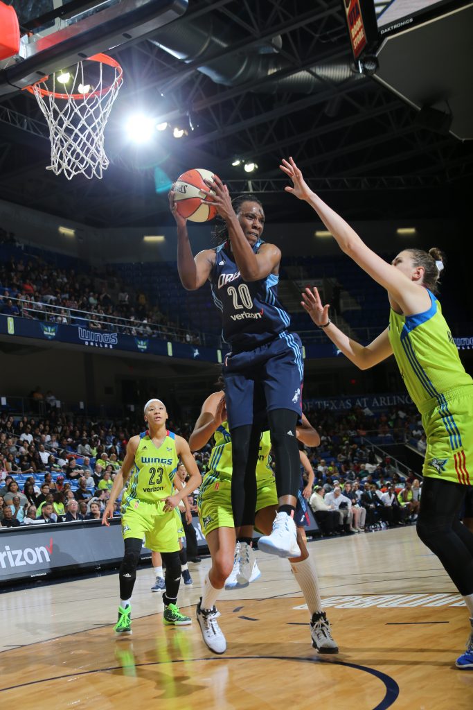 ARLINGTON, TX - MAY 27: Sancho Lyttle #20 of the Atlanta Dream grabs the rebound against the Dallas Wings on May 27, 2016 at College Park Center in Arlington, Texas. NOTE TO USER: User expressly acknowledges and agrees that, by downloading and or using this photograph, user is consenting to the terms and conditions of the Getty Images License Agreement. Mandatory Copyright Notice: Copyright 2016 NBAE (Photos by Layne Murdoch/NBAE via Getty Images)