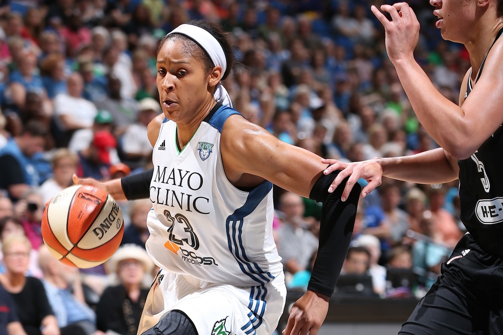MINNEAPOLIS, MN - JULY 12: Maya Moore #23 of the Minnesota Lynx drives to the basket against the San Antonio Stars on July 12, 2015 at Target Center in Minneapolis, Minnesota. NOTE TO USER: User expressly acknowledges and agrees that, by downloading and or using this Photograph, user is consenting to the terms and conditions of the Getty Images License Agreement. Mandatory Copyright Notice: Copyright 2015 NBAE (Photo by David Sherman/NBAE via Getty Images)