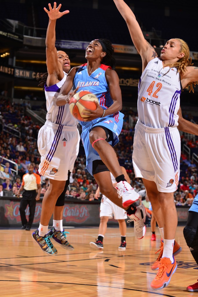 PHOENIX, AZ - JULY 14: Tiffany Hayes #15 of the Atlanta Dream shoots against Monique Currie #25 and Brittney Griner #42 of the Phoenix Mercury on July 14, 2015 at US Airways Center in Phoenix, Arizona. NOTE TO USER: User expressly acknowledges and agrees that, by downloading and or using this Photograph, user is consenting to the terms and conditions of the Getty Images License Agreement. Mandatory Copyright Notice: Copyright 2015 NBAE (Photo by Barry Gossage/NBAE via Getty Images)