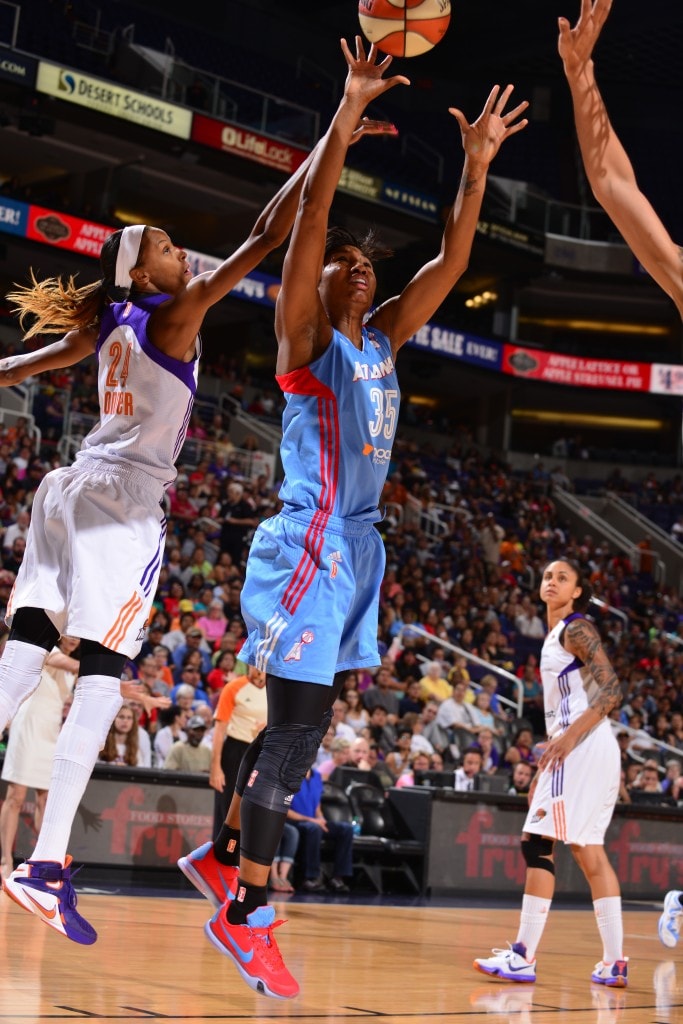 PHOENIX, AZ - JULY 14: Angel McCoughtry #35 of the Atlanta Dream shoots against DeWanna Bonner #24 of the Phoenix Mercury on July 14, 2015 at US Airways Center in Phoenix, Arizona. NOTE TO USER: User expressly acknowledges and agrees that, by downloading and or using this Photograph, user is consenting to the terms and conditions of the Getty Images License Agreement. Mandatory Copyright Notice: Copyright 2015 NBAE (Photo by Barry Gossage/NBAE via Getty Images)