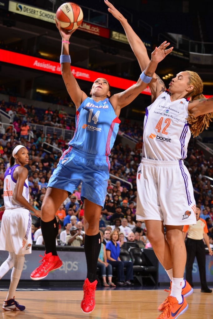 PHOENIX, AZ - JULY 14: Ericka de Souza #14 of the Atlanta Dream shoots against Brittney Griner #42 of the Phoenix Mercury on July 14, 2015 at US Airways Center in Phoenix, Arizona. NOTE TO USER: User expressly acknowledges and agrees that, by downloading and or using this Photograph, user is consenting to the terms and conditions of the Getty Images License Agreement. Mandatory Copyright Notice: Copyright 2015 NBAE (Photo by Barry Gossage/NBAE via Getty Images)