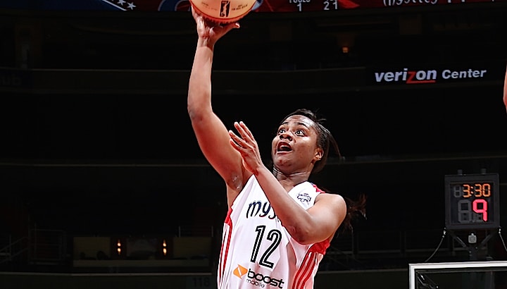 WASHINGTON, DC - AUGUST 28: Ivory Latta #12 of the Washington Mystics shoots the ball against the Phoenix Mercury on August 25, 2015 at the Verizon Center in Washington, DC. NOTE TO USER: User expressly acknowledges and agrees that, by downloading and or using this Photograph, user is consenting to the terms and conditions of the Getty Images License Agreement. Mandatory Copyright Notice: Copyright 2015 NBAE (Photo by Ned Dishman/NBAE via Getty Images)