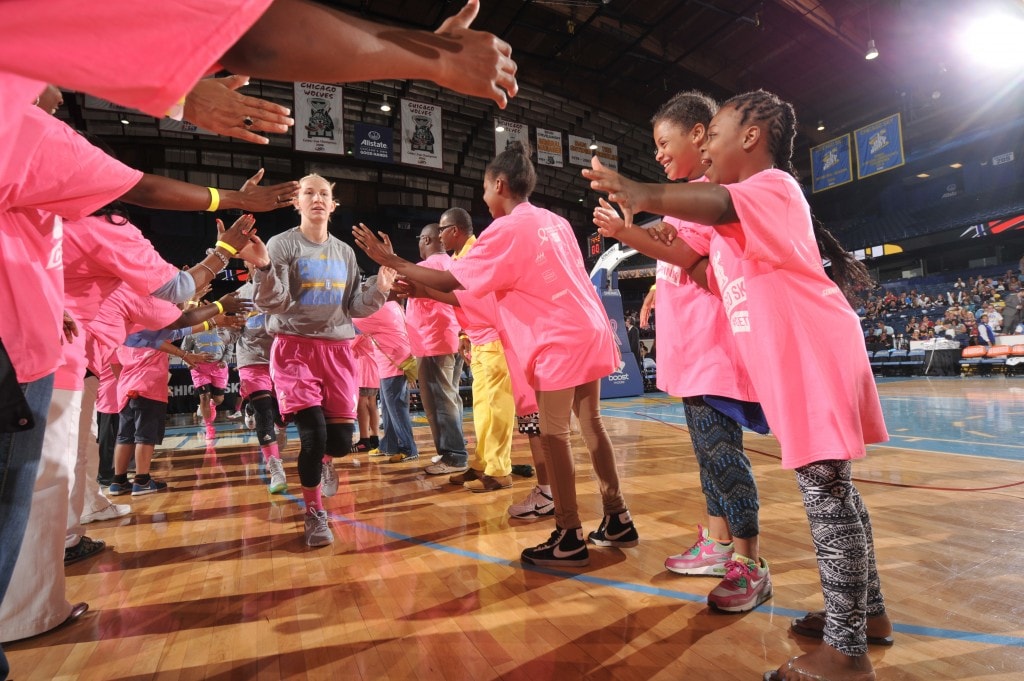 ROSEMONT, IL - AUGUST 9: Courtney Vandersloot #22 of the Chicago Sky hi fives young fans before the game against the Phoenix Mercury on August 9, 2015 at the Allstate Arena in Rosemont, Illinois. NOTE TO USER: User expressly acknowledges and agrees that, by downloading and/or using this photograph, user is consenting to the terms and conditions of the Getty Images License Agreement. Mandatory Copyright Notice: Copyright 2015 NBAE (Photo by Randy Belice/NBAE via Getty Images)
