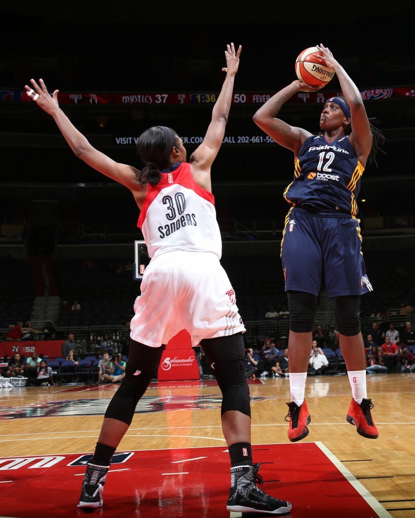 Lynetta Kizer #12 of the Indiana Fever takes a shot against the Washington Mystics