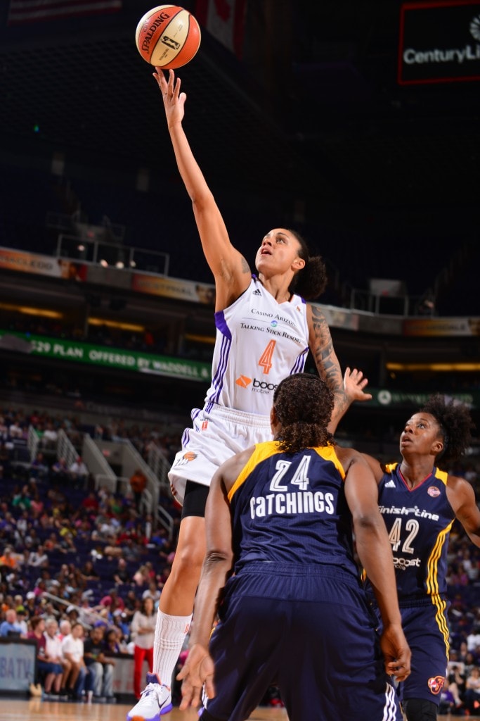 PHOENIX, AZ - AUGUST 16: Candice Dupree #4 of the Phoenix Mercury shoots against Tamika Catching #24 of the Indiana Fever