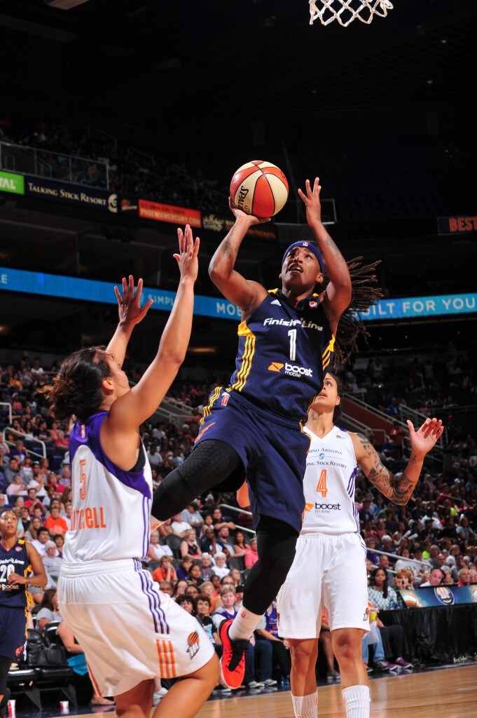 Shavonte Zellous #1 of the Indiana Fever shoots against Leilani Mitchell #5 of the Phoenix Mercury
