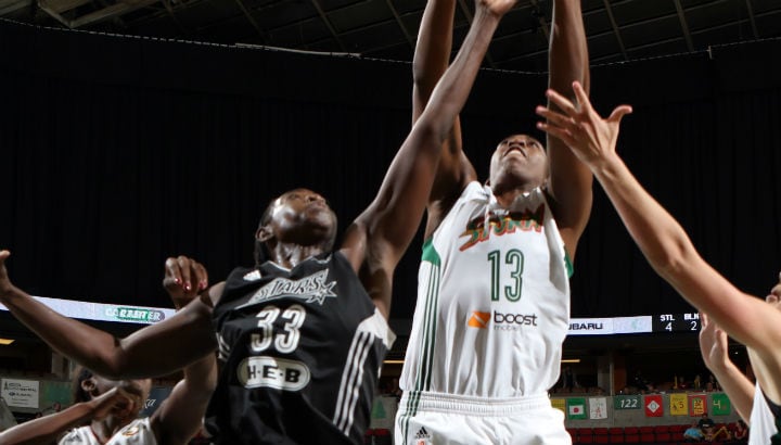 Sophia Young-Malcolm #33 of the San Antonio Stars battles Quanitra Hollingsworth #13 of the Seattle Storm