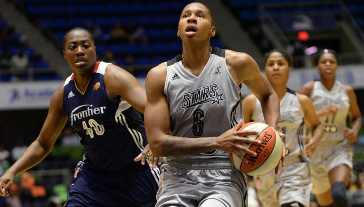 Alex Montgomery #6 of the San Antonio Stars drives to the basket against Shekinna Stricklen #40 of the Connecticut Sun
