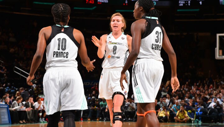 Carolyn Swords #8 of the New York Liberty congratulates her teammates against the Washington Mystics