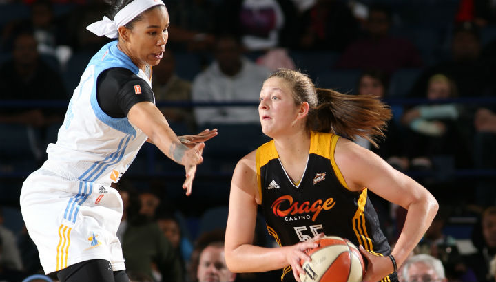 Theresa Plaisance #55 of the Tulsa Shock looks to pass against Tamera Young #1 of the Chicago Sky