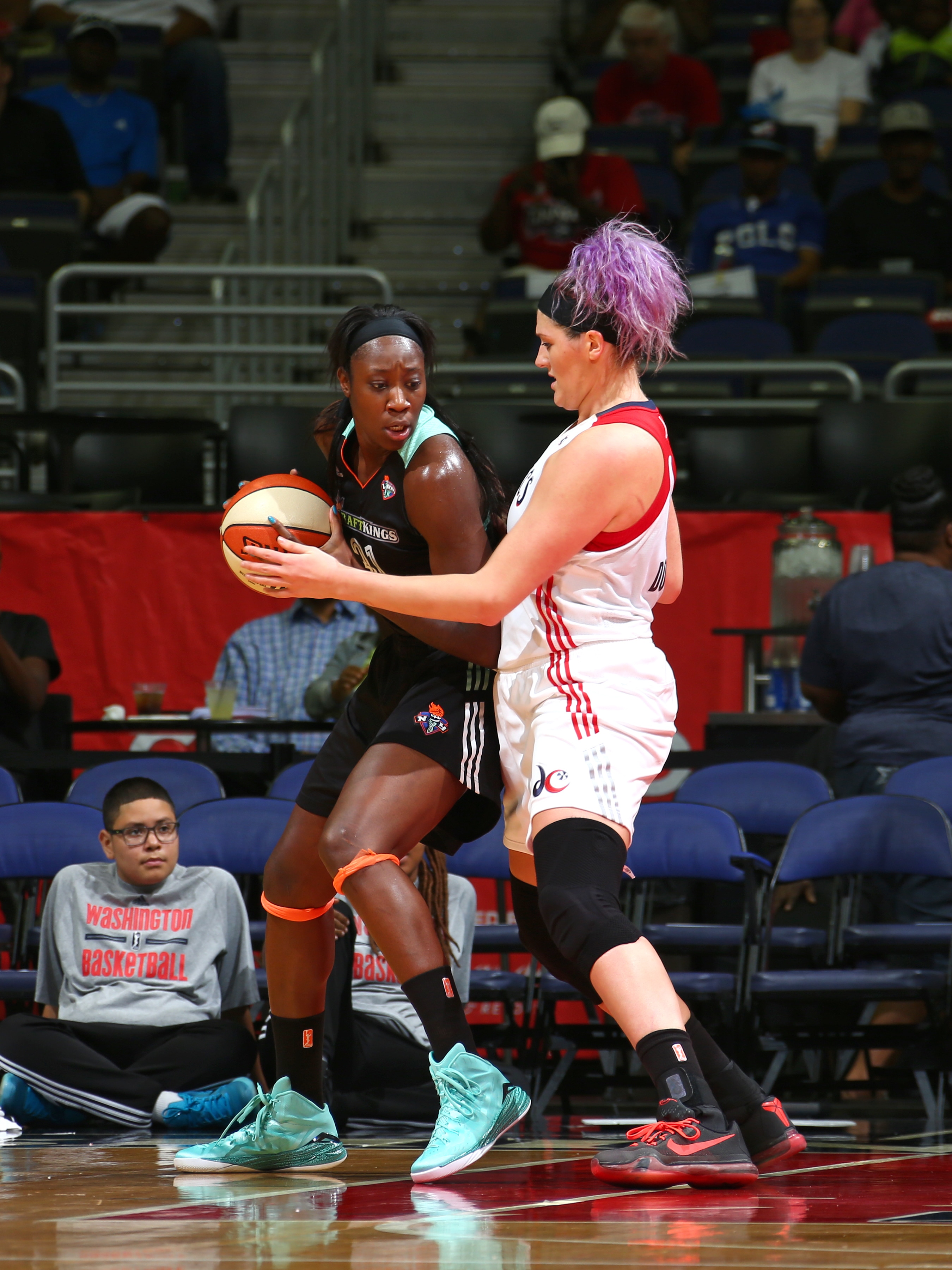 Tina Charles #31 of the New York Liberty handles the ball against Stefanie Dolson #31 of the Washington Mystics