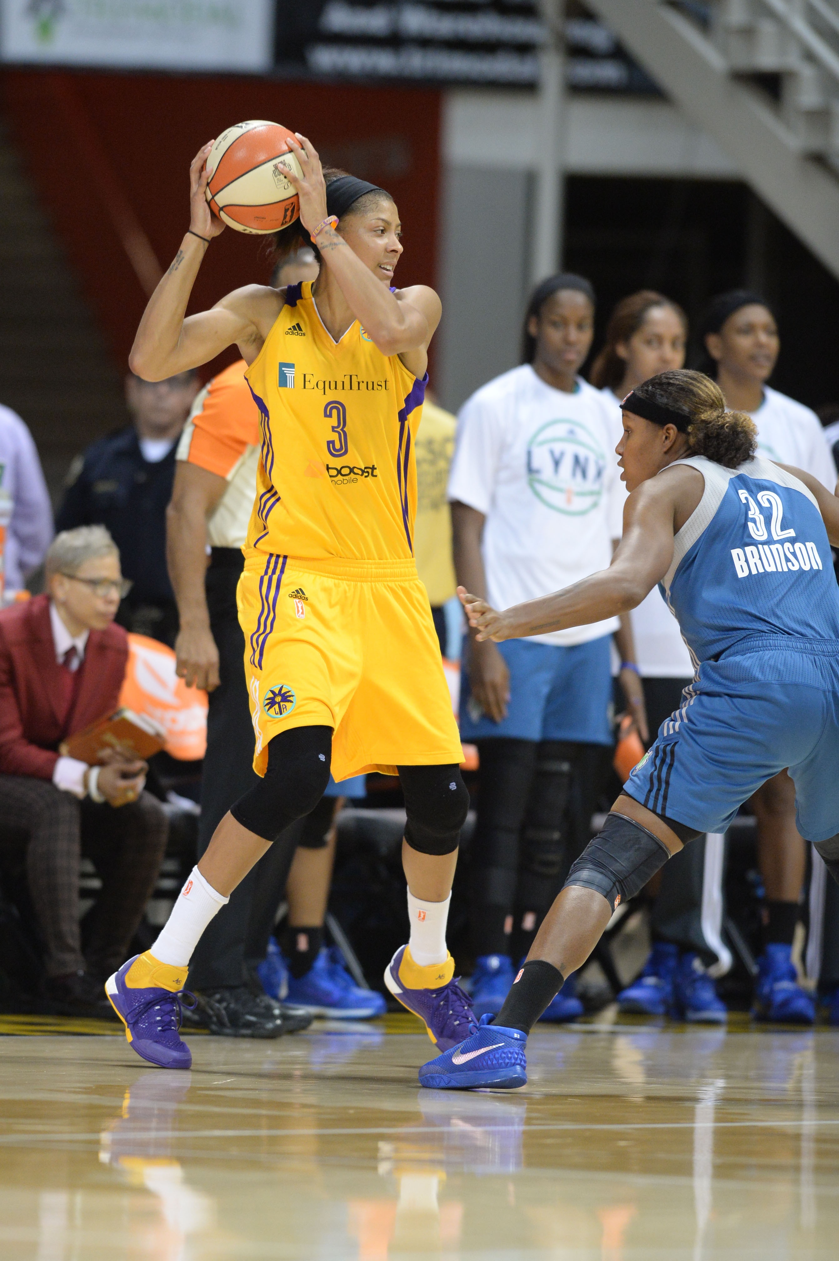 Candace Parker #3 of the Los Angeles Sparks handles the basketball against Rebekkah Brunson #32 of the Minnesota Lynx