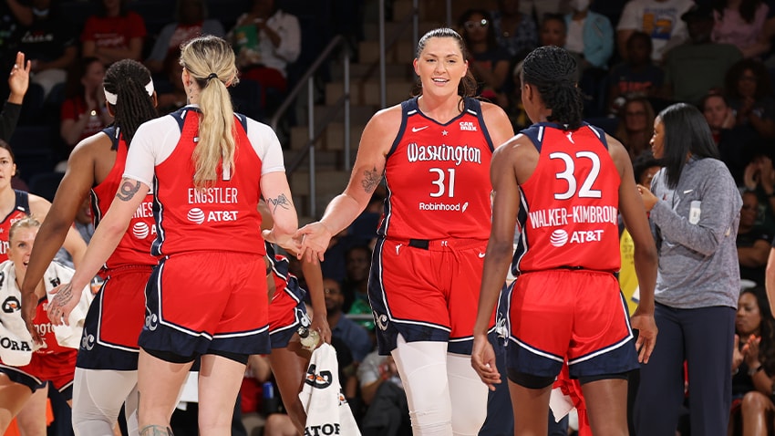Stefanie Dolson high-fiving Emily Engstler and Shatori Walker-Kimbrough